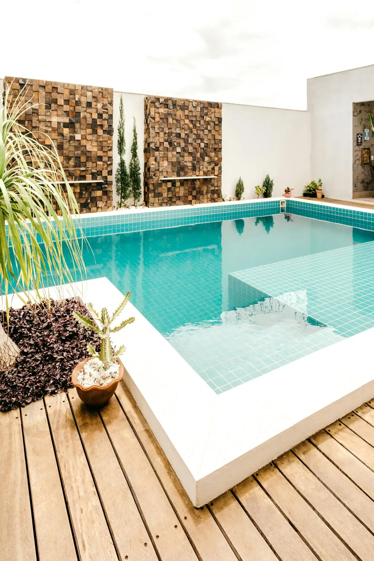Clean wooden deck beside a pool